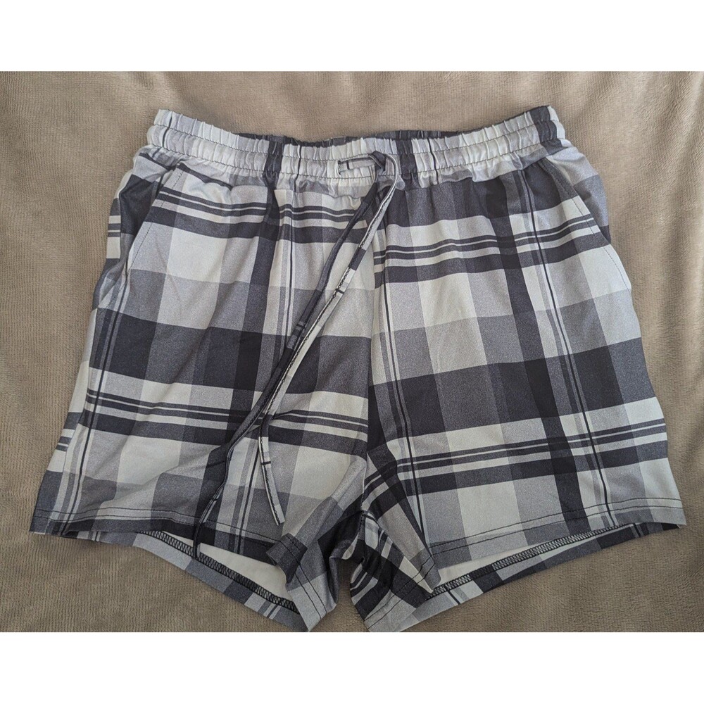 Women's plaid shorts medium elastic waistband with drawstring and pockets.